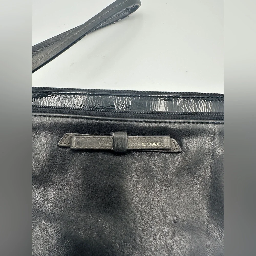 Coach Black Leather Wristlet Wallet With Patent Leather Accent And Bow Detail